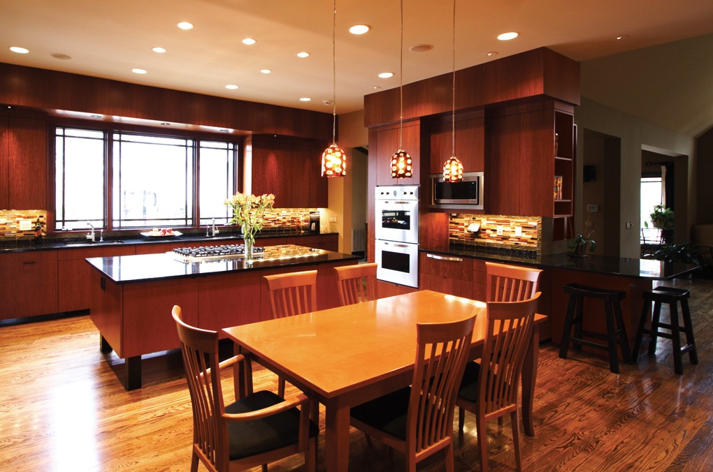 The contrasting woods visually define the kitchen space